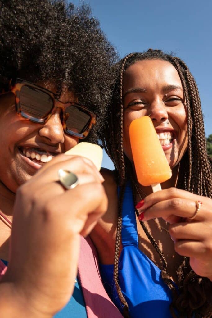 Friends eating popsicles