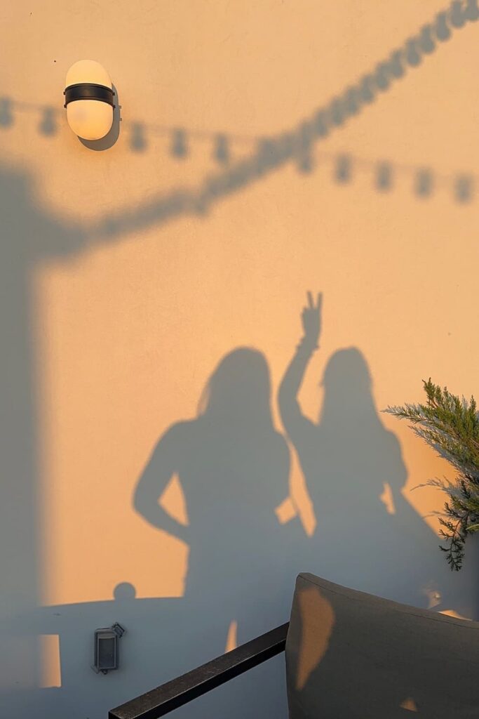 Two friends shadows as they hangout together