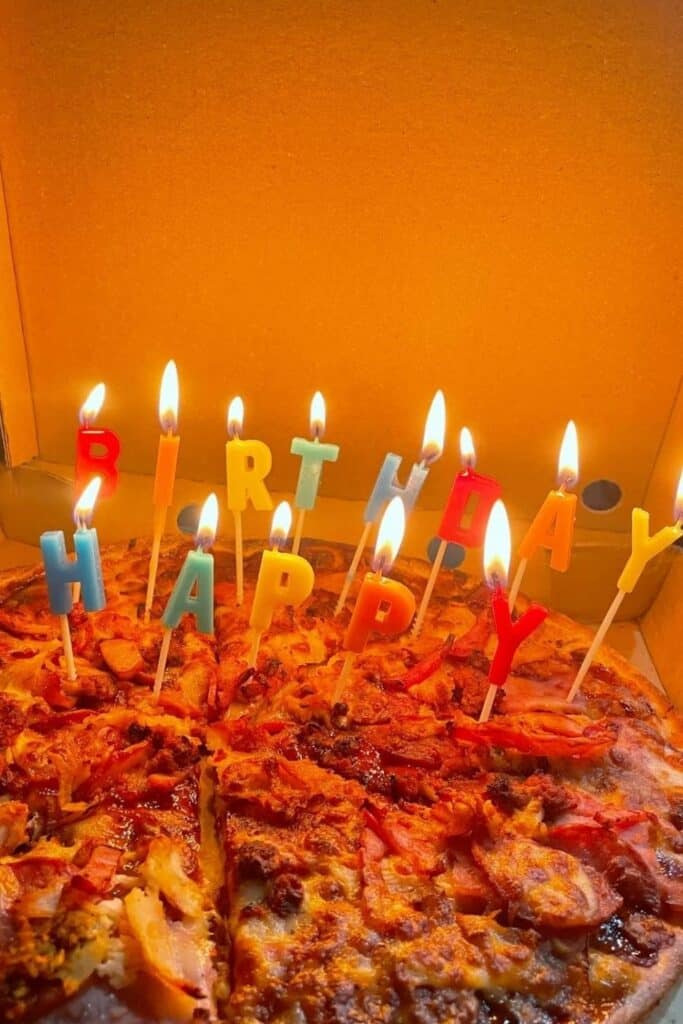 Pizza with birthday candles